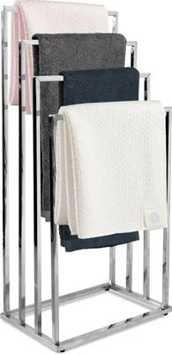 A chrome towel rack with four arms, holding four folded towels of different colors.