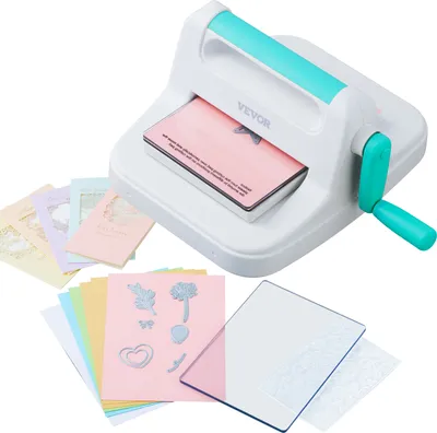 A crafting machine with various accessories like paper, dies, and templates.