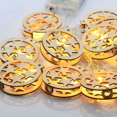 Image de ACA Lighting étoiles rondes en bois, 10 LED décoratives, chaîne à piles (3xAA) + minuterie (6ON/18OFF), blanc chaud, IP20, 135+30cm câble transparent XWBSTARS102AT