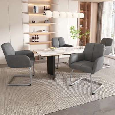 A dining room scene with a table and chairs.