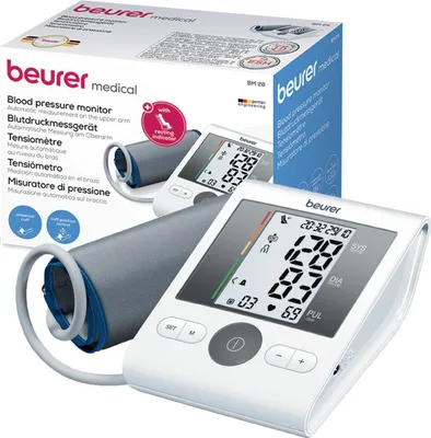 A Beurer Oberarm-Blutdruckmessgerät BM 28 Weiß is shown, with its packaging and the device itself. The device is white with a gray cuff, and the packaging is white with text and images.