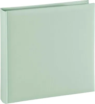 A closed album with a light green cover.