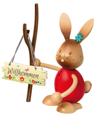 Produktbild von Drechslerei Kuhnert - Dekofigur aus Holz - Hase Stupsi mit Schild "Herzlich Willkommen" - ca. 12cm