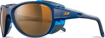 A pair of blue and cyan blue Julbo Explorer 2.0 sunglasses with brown lenses, shown from a side-angle.