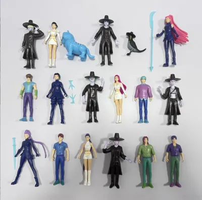 A collection of anime-style action figures arranged on a light gray background.