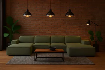 A modern living room with a green sectional sofa, coffee table, and brick wall.