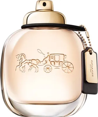 A perfume bottle with a gold cap and a Coach logo embossed on the front.