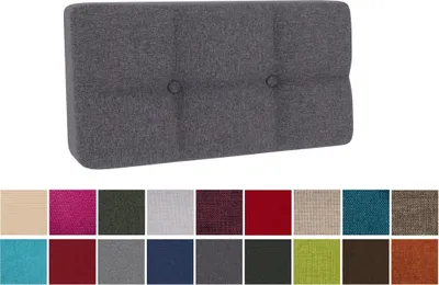 A dark gray tufted cushion for a pallet, with a row of color swatches below.
