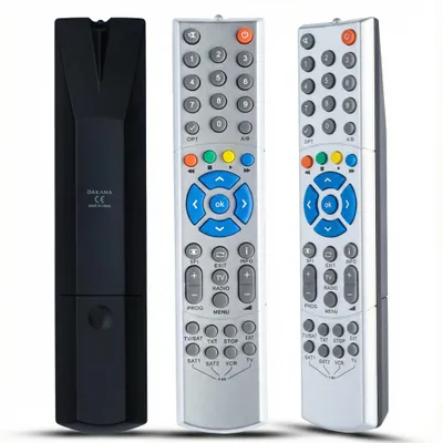 Three remote controls are displayed against a white background. One is black and shown from the back, while the other two are silver and shown from the front.