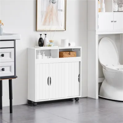 A white bathroom cabinet with sliding doors and an open shelf, placed next to a toilet.
