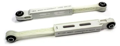 Two white shock absorbers are shown against a white background.