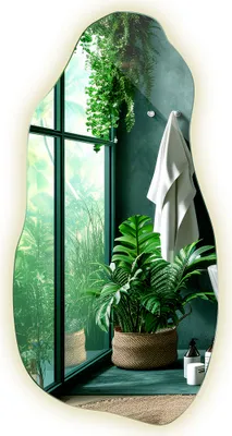 A bathroom scene with a large window overlooking lush greenery, a potted plant, and a towel hanging on the wall.