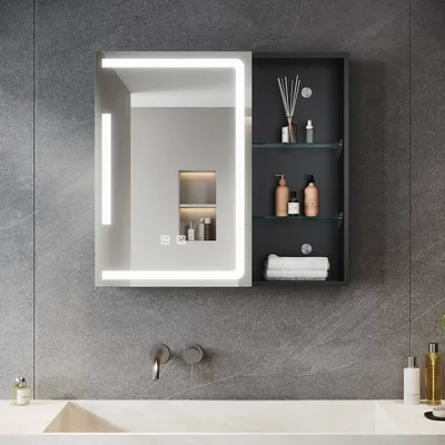 A modern bathroom vanity with a lighted mirror and a medicine cabinet.