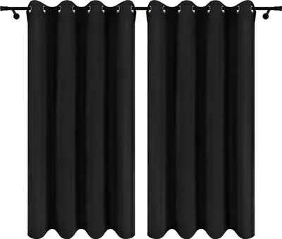 Two black curtains hanging on a curtain rod.