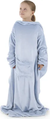 A young girl wearing a light blue blanket with sleeves.