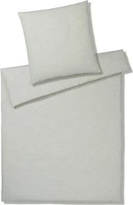 A neatly folded duvet cover and pillowcase set.