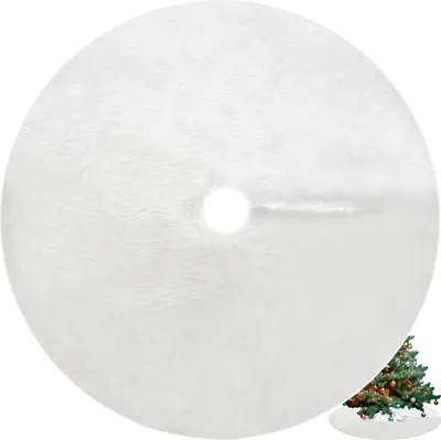 A white, fluffy Christmas tree skirt with a hole in the center for the tree trunk. A small, decorated Christmas tree is visible in the bottom right corner.