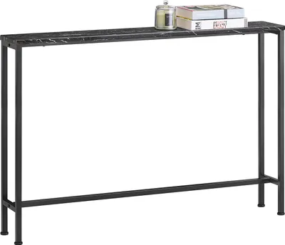 A narrow console table with a marble-look top and black metal legs, shown against a white background. Two books and a candle are placed on the tabletop.