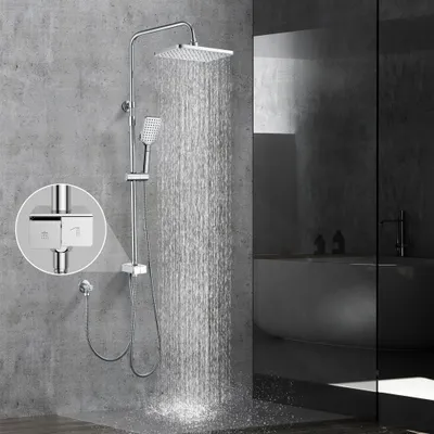 A modern bathroom with a chrome shower system in use.