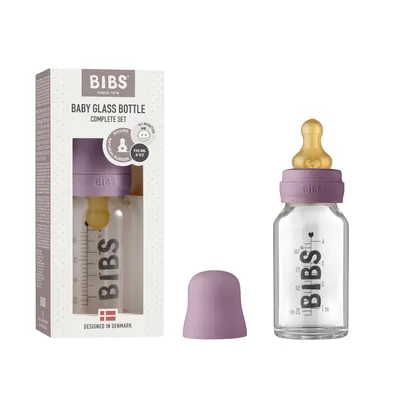 Zdjęcie produktu dla Butelka szklana dla niemowląt BIBS 110 ml, zmniejsza ryzyko wystąpienia kolki, okrągły smoczek z naturalnego lateksu, wspomaga karmienie piersią. Wyprodukowano w Danii, kompletny zestaw – 110 ml, kolor fioletowo-różowy