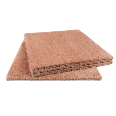 A stack of square carpet tiles with a textured, fluffy surface in a muted pink color.