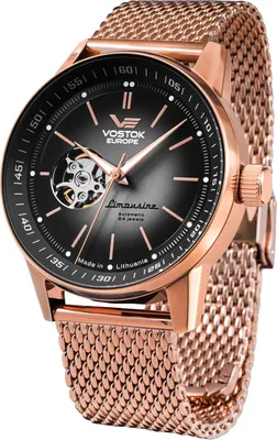A close-up studio shot of a Vostok Europe Limousine watch with a black dial and rose gold case and mesh strap.