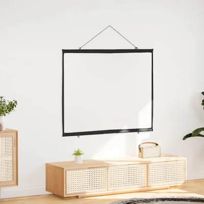 A white projection screen is hanging on a white wall above a wooden media console.