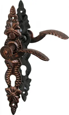A decorative door handle set with a long backplate, designed in a rustic, wrought iron style with copper accents.