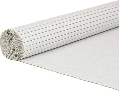A rolled-up white PVC garden fence on a white background.