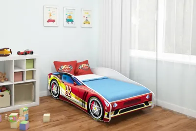 A child's bedroom with a race car-themed bed.