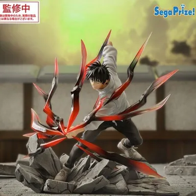 A figurine of an anime character with red and black tendrils, posed dynamically on a rocky base.