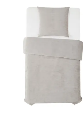 A top-down view of a bedding set on a white background.