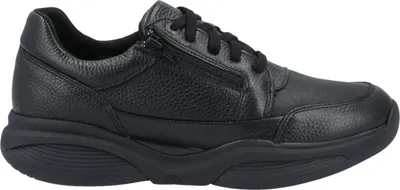 A studio shot of a single black sneaker.