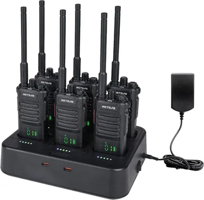A set of six Retevis RT86 walkie-talkies are neatly arranged in a multi-unit charging dock. A power adapter is connected to the dock.