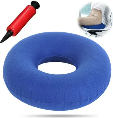 A blue inflatable ring cushion and a red hand pump are shown against a white background. A small inset image shows a person sitting on the cushion in a chair.