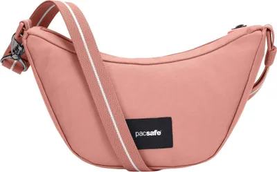 A pink Pacsafe crossbody bag is shown against a white background.