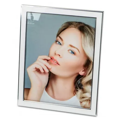 A silver and white photo frame with a picture of a woman inside.
