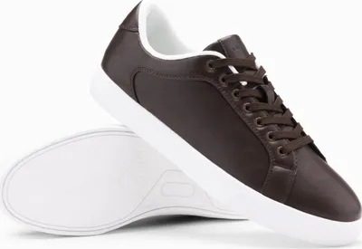 A pair of brown leather sneakers with white soles and laces, shown from a slightly elevated side angle against a white background.