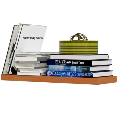 A wooden shelf with several books and a decorative box.