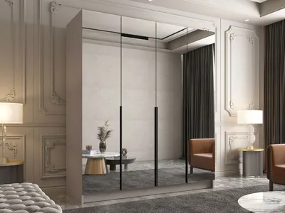 A modern bedroom with a large mirrored wardrobe, two accent chairs, and decorative elements.