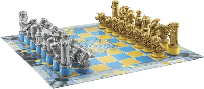 A chess set with silver and gold pieces on a blue and yellow board.