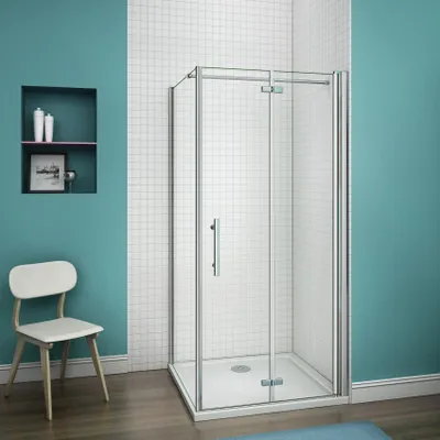 A modern bathroom with a shower cabin, a chair, and a wall niche.