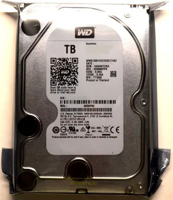A Western Digital hard drive is shown from the front, with its label clearly visible.