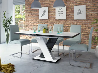 A dining room set with a modern table and chairs.