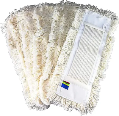 A stack of white cotton mop heads with a white backing attached to one of them.