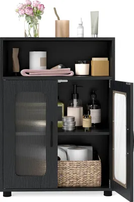 A black bathroom cabinet with two doors, one of which is open, displaying various bathroom items inside.