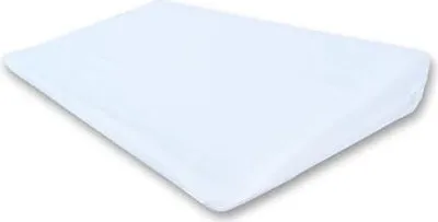 A white wedge pillow on a white background.