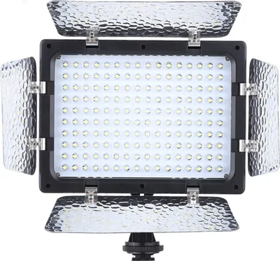 A product shot of a camera light panel with adjustable barn doors.