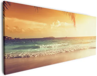 Produktbild von Wallario Premium Leinwandbild Sonnenuntergang am Strand in der Karibik in Größe 50 x 125 cm