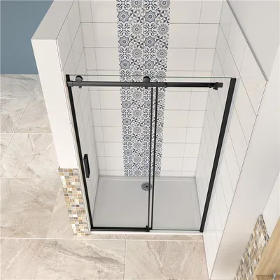 A modern shower cabin with a sliding door and decorative tiles.